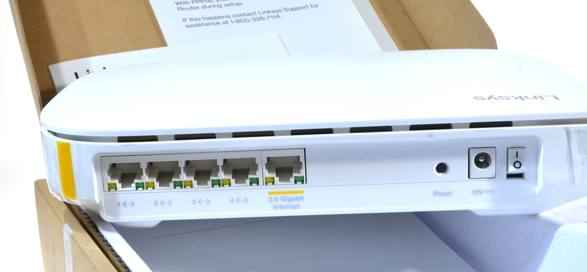 White router with multiple ports on a cardboard box